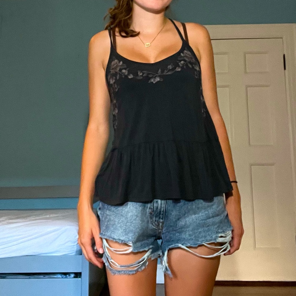 black tank with floral embroidered chest, racer back